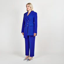 Load image into Gallery viewer, Side view of the Femponiq Asymmetric Double-Breasted Tailored Blazer in Royal Blue, showcasing its sleek fit, asymmetric design, and elegant details.