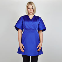 Load image into Gallery viewer, Close-up of Femponiq Royal Blue Pleated Shoulder Kimono Sleeve Satin Duchess Dress, detailing the intricate pleated shoulder design and the rich texture of the satin duchess fabric.