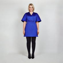 Load image into Gallery viewer, Model wearing Femponiq Royal Blue Pleated Shoulder Kimono Sleeve Satin Duchess Dress, showcasing the structured kimono sleeves and elegant pleated shoulder detail in luxurious satin fabric.