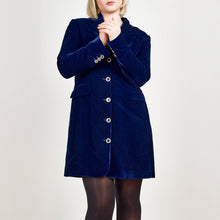 Load image into Gallery viewer, Model wearing Femponiq Velvet Tailored Blazer Dress in Royal Blue, showcasing a close-up view with a fitted silhouette, and the elegant button details on the sleeves and centre front.