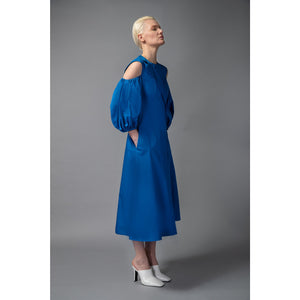 Model Is Wearing Asymmetric A-Line Cotton Dress in Blue - Front Side  View