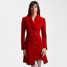 Load image into Gallery viewer, Front view of the Femponiq Asymmetric Pleated Blazer Dress in red, showing the wide peak collar, asymmetric button closure, padded shoulders, flap pockets and A-line tailored silhouette. The hand-crafted queen-motif buttons and clean pleats highlight the refined, structured design.

