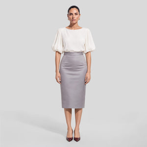 FEMPONIQ pearl white vegan cupro blouse with voluminous elbow-length puff sleeves and a round neckline, shown on a model from the front.