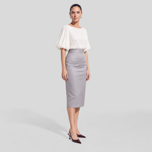 
FEMPONIQ pearl white vegan cupro blouse with voluminous elbow-length puff sleeves and a round neckline, shown on a model in three-quarter view.