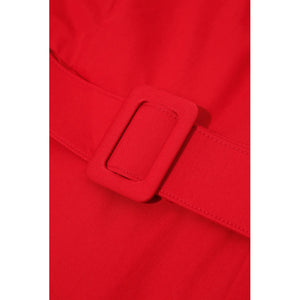 Close-up of belt detail on a red wide-lapel belted cotton dress