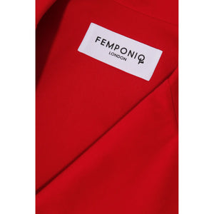 Close-up of lapel stitching and label on red wide-lapel cotton dress