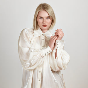 Model wearing the Femponiq Gathered Neck Voluminous Raglan Sleeve Shirt in Pearl White, highlighting the gathered neckline and luxurious fabric texture in a close-up view.