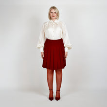 Load image into Gallery viewer, Model wearing the Femponiq Gathered Neck Voluminous Raglan Sleeve Shirt in Pearl White, showcasing its elegant silhouette and voluminous raglan sleeves in a front view.
