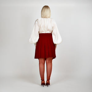 Model wearing the Femponiq Gathered Neck Voluminous Raglan Sleeve Shirt in Pearl White, emphasizing the smooth drape and seamless construction from the back view.