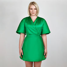 Load image into Gallery viewer, Close-up of Femponiq Green Pleated Shoulder Kimono Sleeve Satin Duchess Dress, detailing the intricate pleated shoulder design and the rich texture of the satin duchess fabric.
