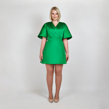 Load image into Gallery viewer, Model wearing Femponiq Green Pleated Shoulder Kimono Sleeve Satin Duchess Dress, showcasing the structured kimono sleeves and elegant pleated shoulder detail in luxurious satin fabric.
