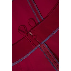 Close-up view of the inner waist and zip of the Femponiq High-Waisted Pleated Above-the-Knee Skirt in rich Wine, showcasing bounded contrast parsley lining for a refined finish.