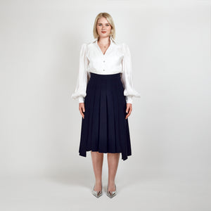 Front view of the Femponiq High-Waisted Pleated Midi Skirt with Asymmetric Dual Side Slits in Navy, featuring an elegant pleated design and asymmetric silhouette.

