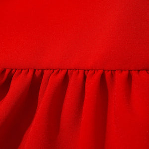 Close-up of red fabric with a textured surface