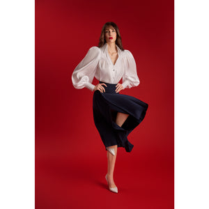 Model wearing the Femponiq Puff Sleeve V-Neck Gathered Shirt in sheer white, featuring voluminous sleeves and sparkling buttons.