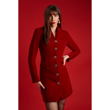 Load image into Gallery viewer, Femponiq Tailored Red Velvet Blazer Dress with crystal-style handcrafted buttons and peak lapels, shown on model against a red backdrop.
