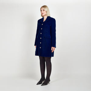 Model wearing Femponiq Velvet Tailored Blazer Dress in Royal Blue, showcasing a side view with a fitted silhouette and elegant design.