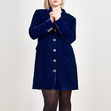 Load image into Gallery viewer, Model wearing Femponiq Velvet Tailored Blazer Dress in Royal Blue, showcasing a close-up view with a fitted silhouette, and the elegant button details on the sleeves and centre front.
