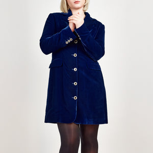 Model wearing Femponiq Velvet Tailored Blazer Dress in Royal Blue, showcasing a close-up view with a fitted silhouette, and the elegant button details on the sleeves and centre front.