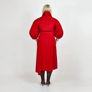 Back view of Femponiq’s Wide Lapel Asymmetric Belted Midi Cotton Dress in vibrant red, showcasing its stylish wide lapels, side slit pockets, unique asymmetric design, and a belted waist that enhances the silhouette.