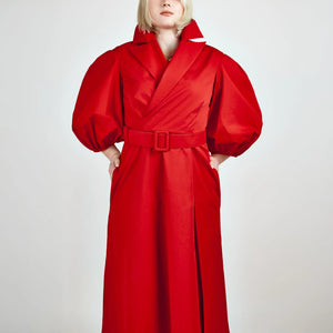 Close-up view of Femponiq’s Wide Lapel Asymmetric Belted Midi Cotton Dress in vibrant red, showcasing its stylish wide lapels, unique asymmetric design, side slit pockets and a belted waist that enhances the silhouette.