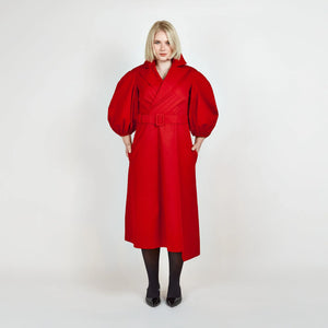 Front view of Femponiq’s Wide Lapel Asymmetric Belted Midi Cotton Dress in vibrant red, showcasing its stylish wide lapels, unique asymmetric design, side slit pockets and a belted waist that enhances the silhouette.
