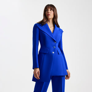Front close-up of the Femponiq Asymmetric Pleated Blazer in Blue, showcasing a tailored fit, asymmetric detailing, and a bold, elegant silhouette.