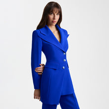 Load image into Gallery viewer, Front close-up side view of the Femponiq Asymmetric Pleated Blazer in Blue, showcasing a tailored fit, asymmetric detailing, and a bold, elegant silhouette.
