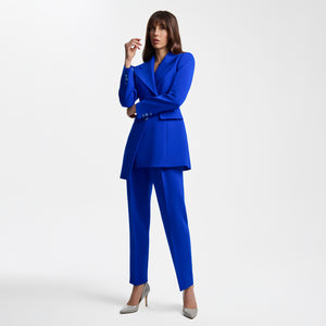 Model wearing the Femponiq Asymmetric Pleated Blazer in Blue, featuring a tailored fit, asymmetric design, and a bold, elegant silhouette.