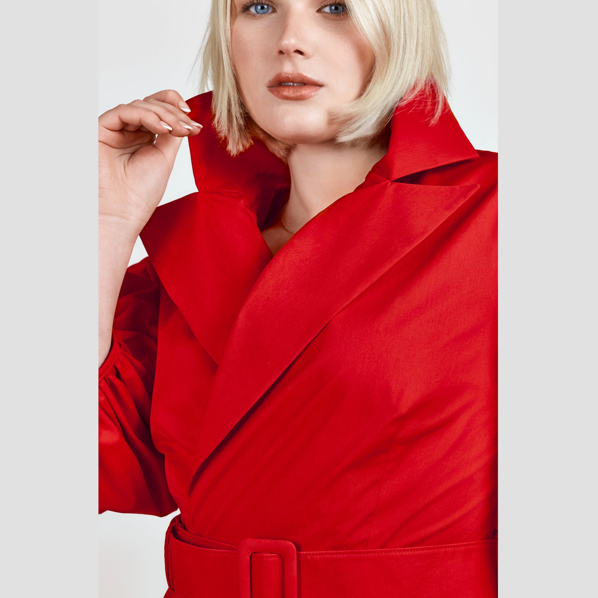 Video of a model showcasing the Femponiq Wide Lapel Asymmetric Belted Midi Cotton Dress in Red, featuring its tailored silhouette, wide lapel design, and elegant belted waist.