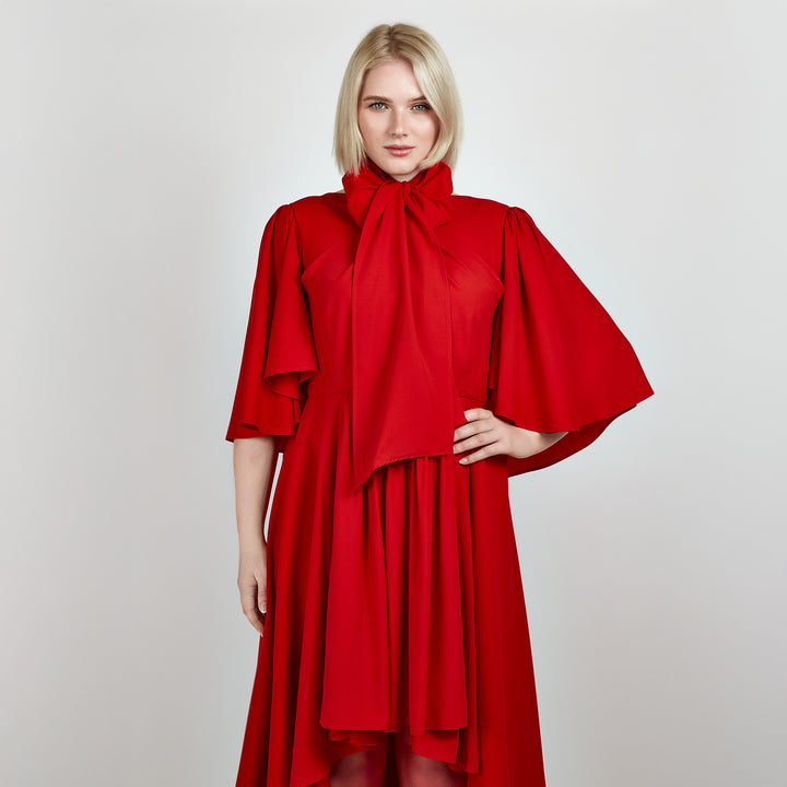 Video of a model wearing the Femponiq Bow Tie Neck Cape Sleeve Maxi Dress in Red, highlighting its flowing silhouette and elegant bow tie neckline.