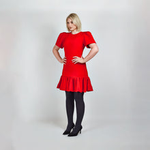 Load and play video in Gallery viewer, Video clip of model walking in Femponiq Red Pleated Shoulder Peplum Hem Cady Dress, showcasing its fluid movement and sophisticated design.
