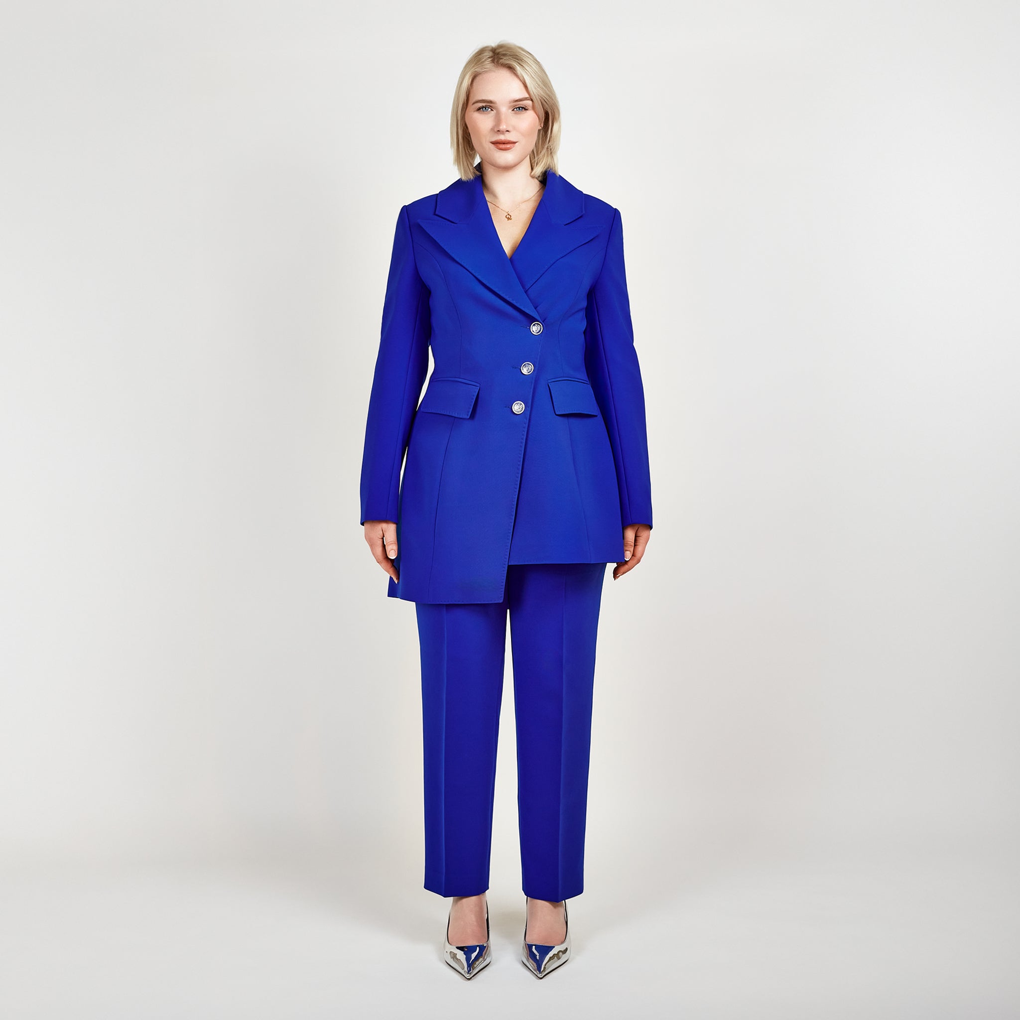 Video of a model wearing the Femponiq Asymmetric Double-Breasted Tailored Blazer in Royal Blue paired with matching High-Waisted Tailored Trousers, showcasing a sleek, elegant look.