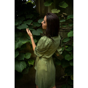 Model is wearing Femponiq Green Wrap Dress