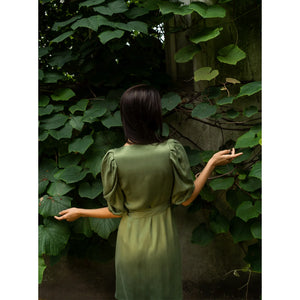 Model is wearing Femponiq Green Wrap Dress - Back Look