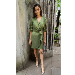 Model is wearing Femponiq Green Wrap Dress