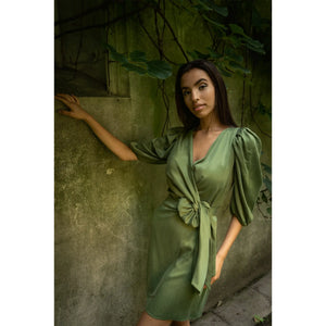 Model is wearing Femponiq Green Wrap Dress
